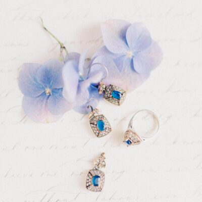 Jewelry and Purple Flowers in a Studio